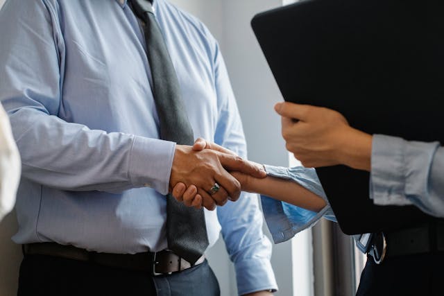 landlord and property manager shaking hands